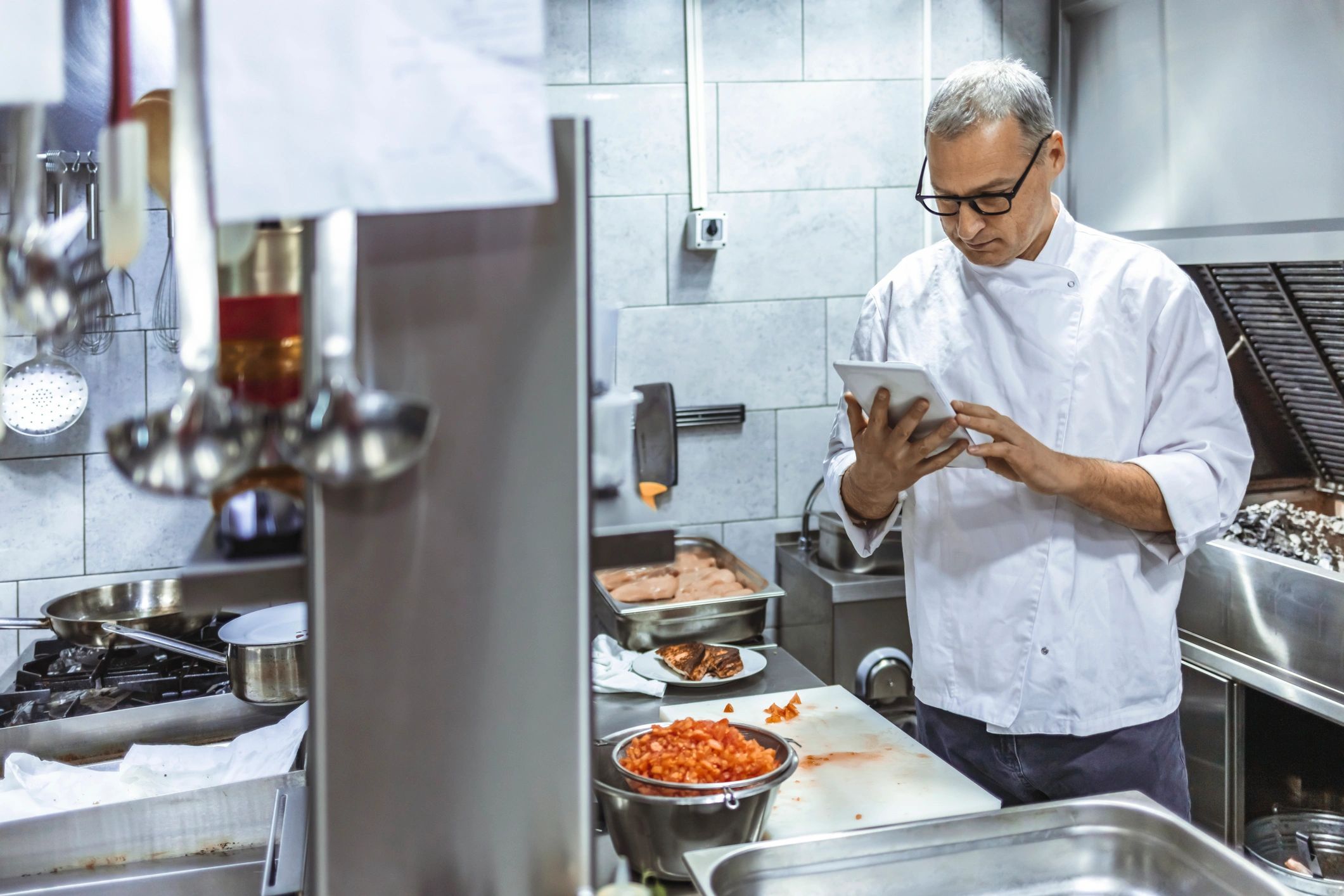 Chef using a tablet in the kitchen