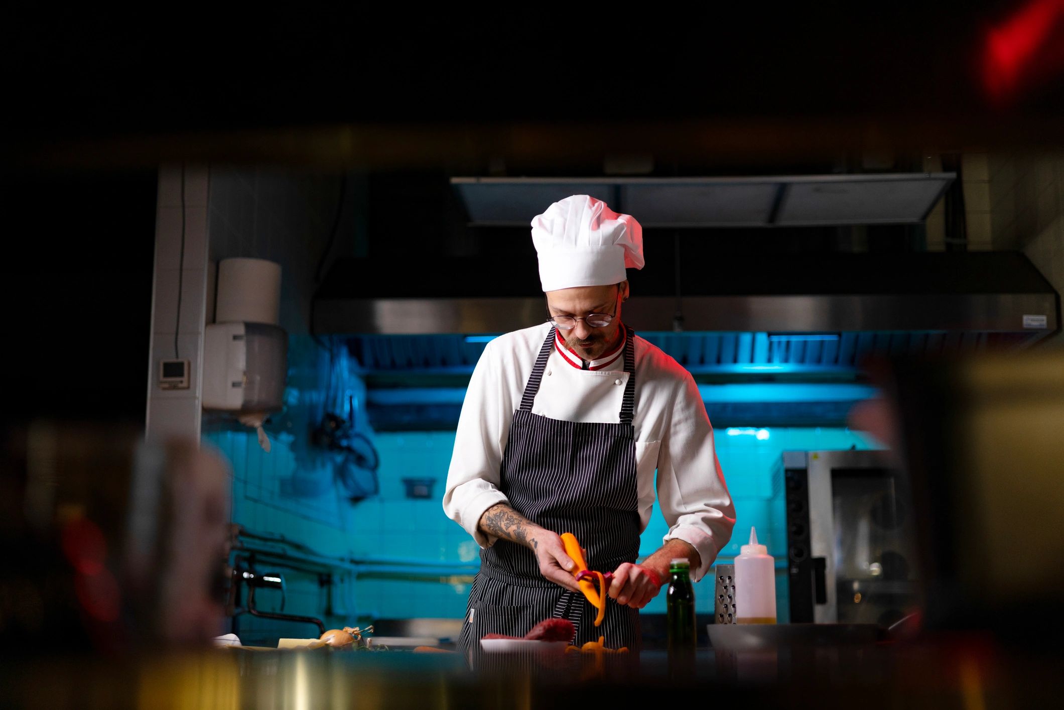 Chef in kitchen preparing ingredients