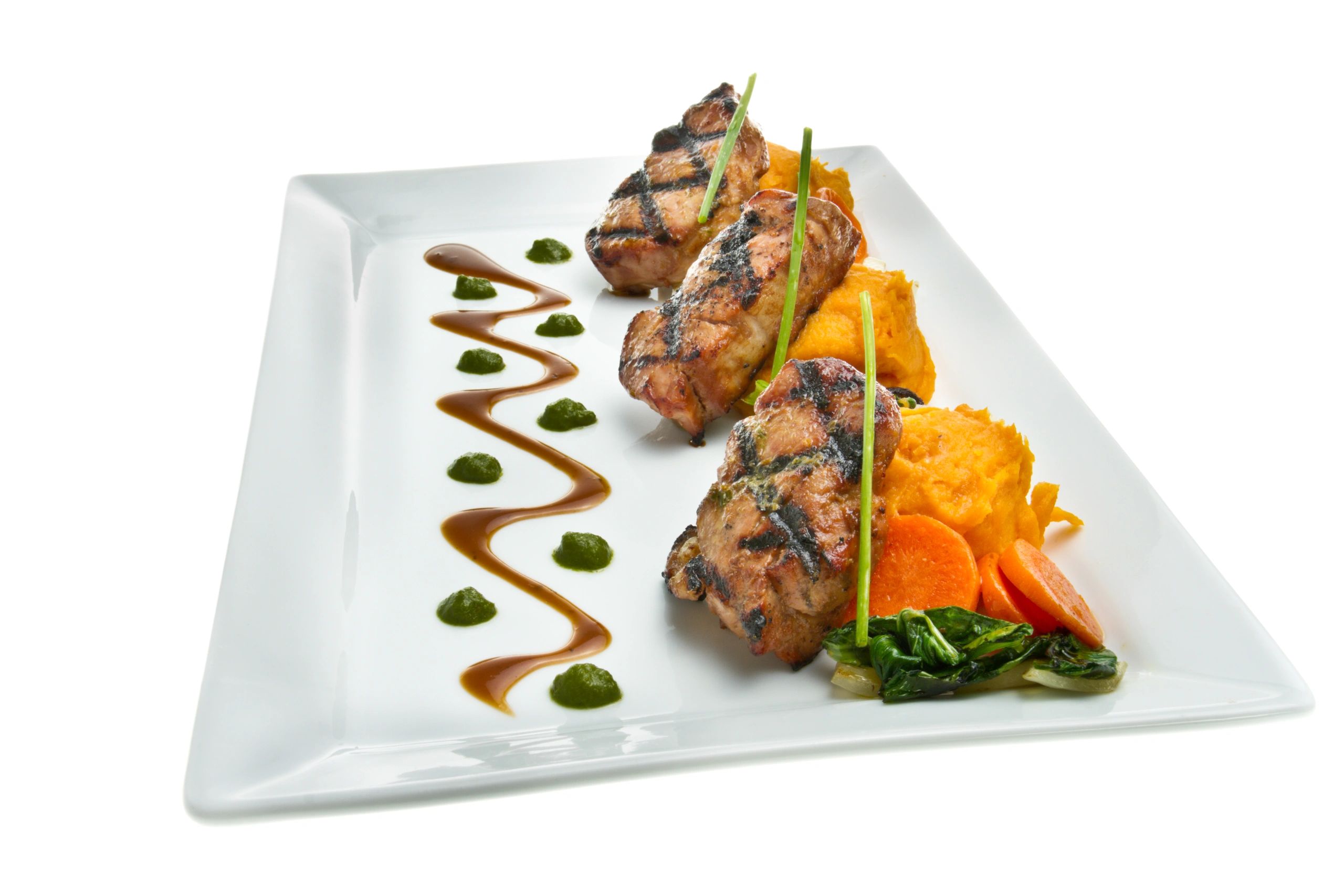 Plated pork medallions with mashed sweet potato