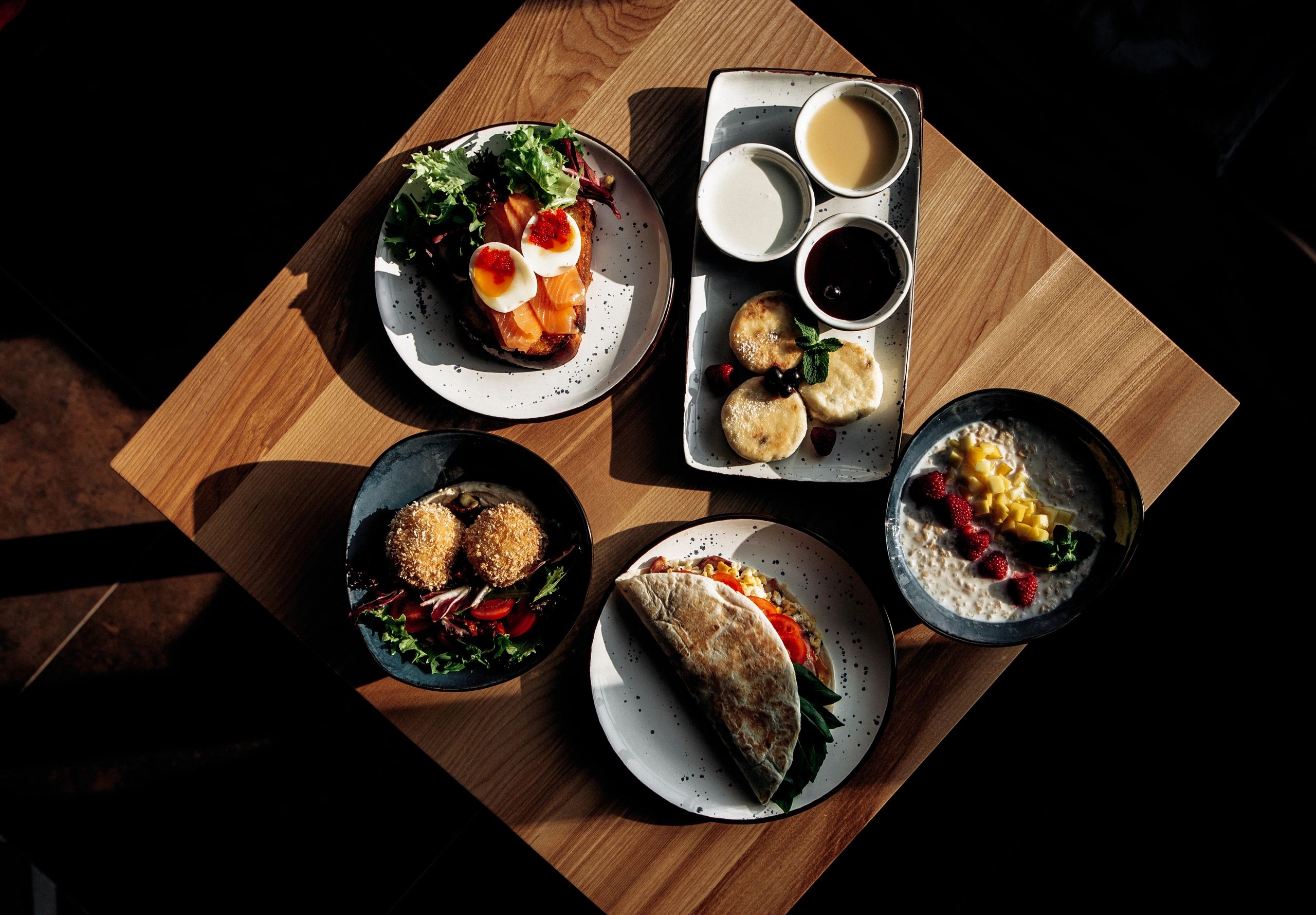 Overhead spread of assorted gourmet dishes